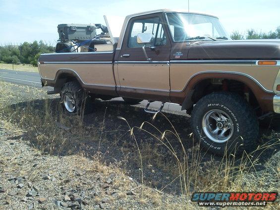 Brown and tan 1979 Ford F-150 pickup truck side view with cargo in bed