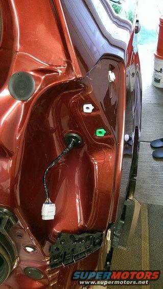 Red rear bumper area with wiring harness and connectors