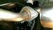 2015 Subaru Forester - Close-up view of a vehicle's exhaust system connection, showing a flange and gasket.
