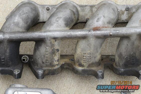 Aluminum intake manifold with 'GERMANY' and '051133 206B' cast into it