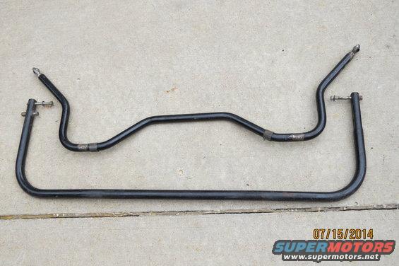 Two black sway bars on concrete, one U-shaped and one curved