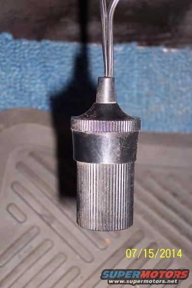 Close-up of a cigarette lighter socket with wires