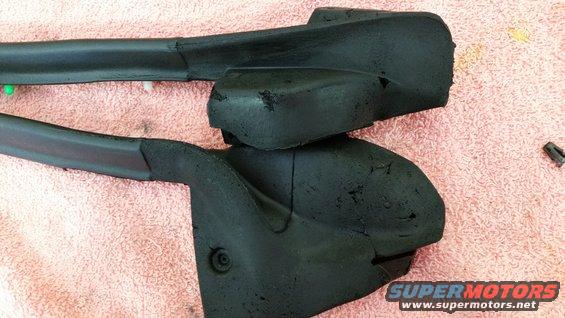 Two black rubber weatherstripping pieces on a pink towel