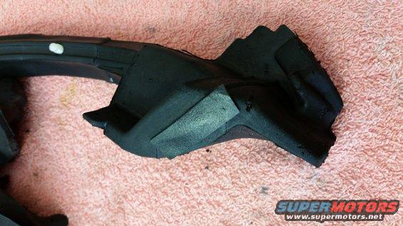 Black rubber seal part on pink textured surface