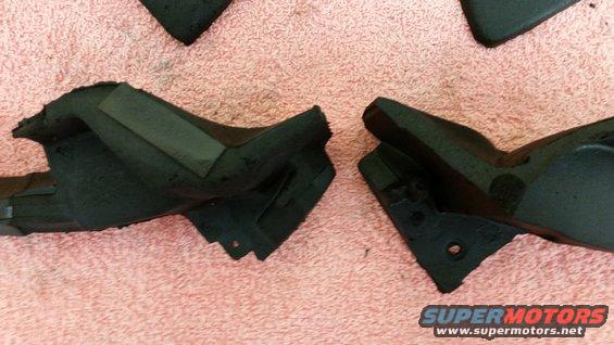 Black rubber car parts on pink fabric