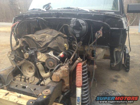 1979 Ford Bronco engine bay with engine removed, showing suspension and frame