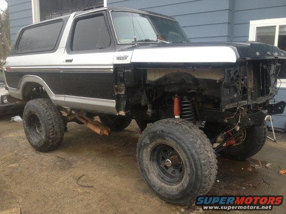Ford Bronco with front end removed, lifted suspension, and large tires