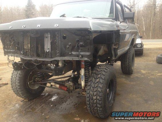 1979 Ford Bronco front end with grille removed, showing engine bay and suspension components