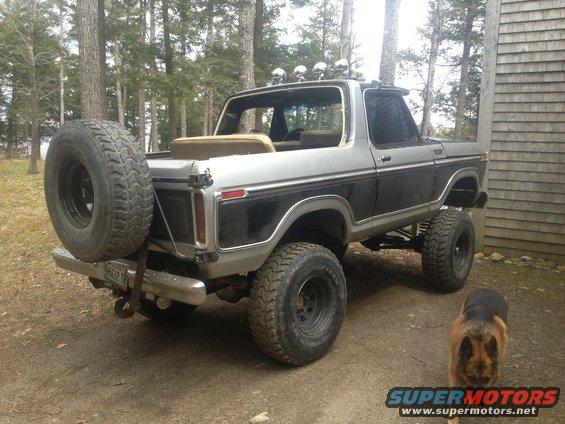 1979 Ford Bronco with spare tire on rear, lifted suspension, and roof lights