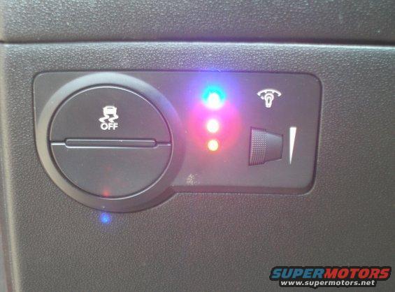 Dashboard with traction control off button and indicator lights