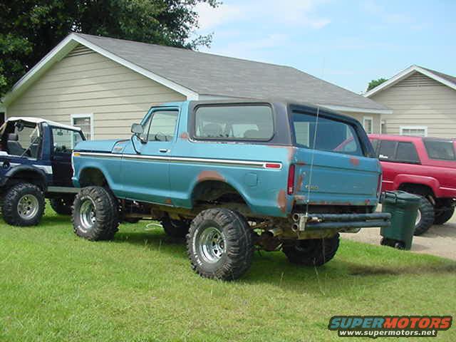 Blue 1979 Ford Bronco, 3/4 front view, lifted with large tires