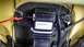 2009 Ford Expedition - Close-up of an AC seat part with a visible barcode and label, showing internal components.