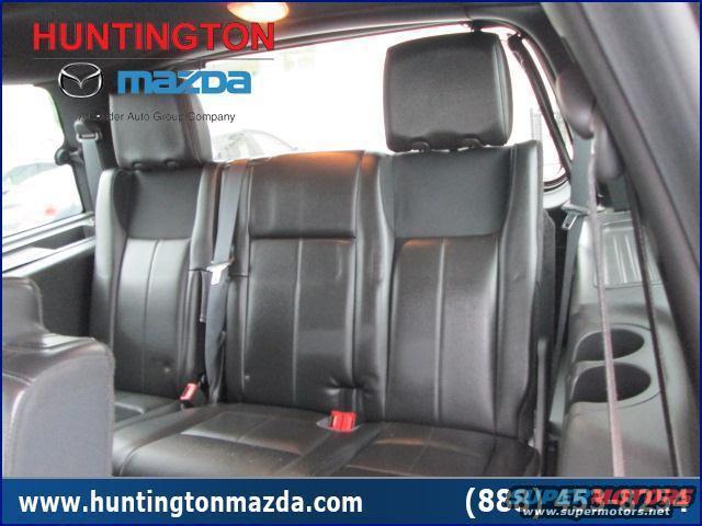 Rear seats and seatbelts inside a vehicle. Watermark shows 'Huntington Mazda'