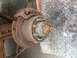 1978 Ford Bronco - Close-up of a heavily rusted vehicle brake rotor and hub assembly, showing significant wear and tear.