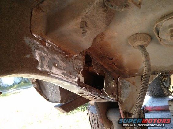rusted frame damage on vehicle undercarriage