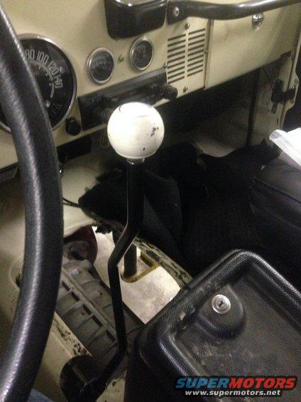 1986 Jeep CJ interior showing steering wheel, dashboard gauges, and floor shifter