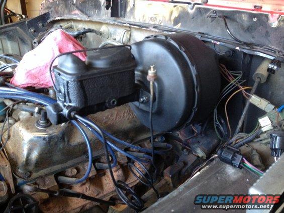 Brake booster and master cylinder assembly in engine bay