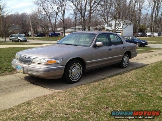 Tan 1994 Mercury Grand Marquis sedan, 3q front view