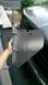 1996 Ford F-150 - A person holds a detached plastic trim piece against the side of a dark-colored vehicle.