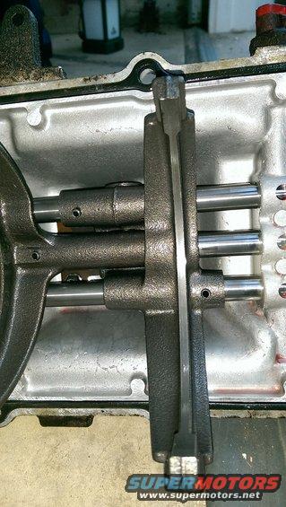 Close-up of internal transmission components with metal shafts and levers