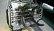 1996 Ford F-150 - Internal view of a transmission, showing shift forks and rods within the metal casing.