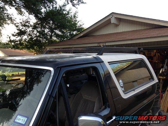 1993 Ford Bronco side view showing roof rack and interior