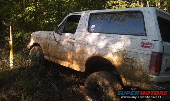 Mud-covered 1990 Ford Bronco side view