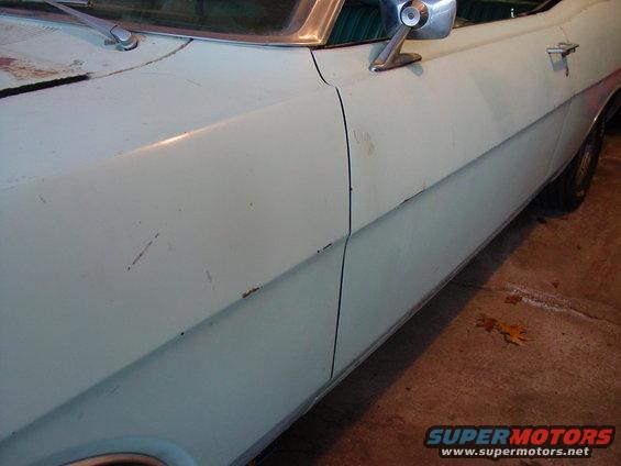 1969 Ford Torino side view showing door and fender with minor rust spots