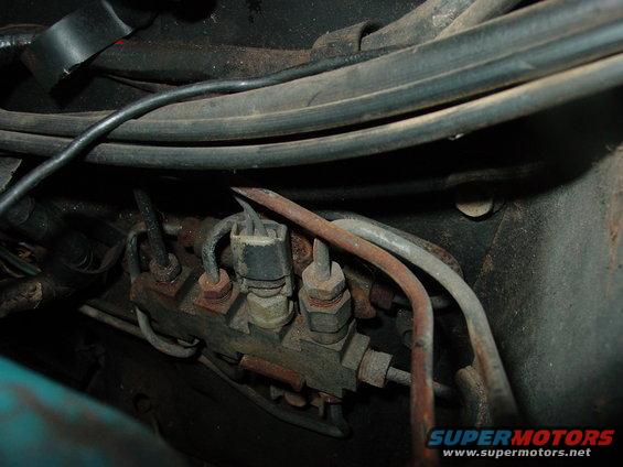 1969 Ford Torino brake fluid pressure regulator, rusty, close-up view