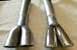 1968 Mercury Cougar - Pair of dual exhaust tips, one polished chrome and one raw metal, laid out on a towel.