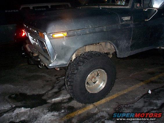 1979 Ford F-Series truck front fender, headlight, and large off-road tire