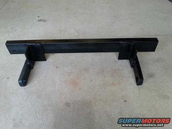 black metal bracket with two mounting points on each side