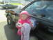 2003 Ford Crown Victoria - A young child stands next to a Florida State Trooper police car, with another vintage car visible in the background.