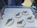 2003 Ford Crown Victoria - A tray of cookies decorated with a grey horse logo, possibly representing a Ford Mustang.
