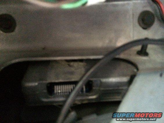Close-up of a vehicle's dashboard showing a vent and some wiring