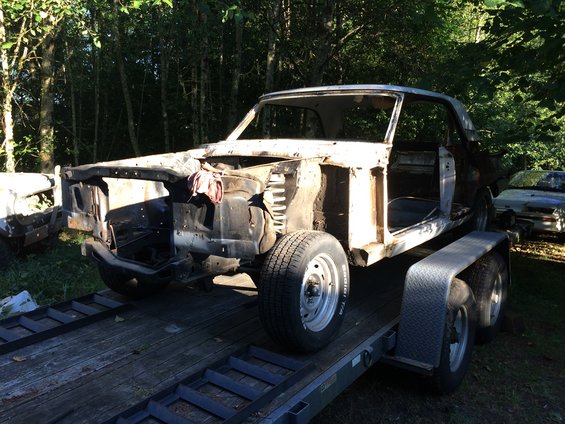 1964 Ford Fairlane deconstructed on trailer, front quarter view