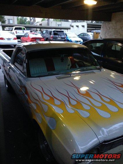1966 Ford Ranchero with flame decals, silver paint, and red/white interior