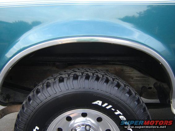 1996 Ford Bronco rear wheel well and tire with "All-Terrain" text