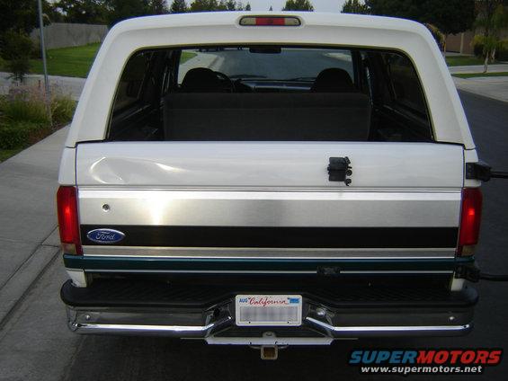 White Ford Bronco rear view, chrome bumper, California license plate