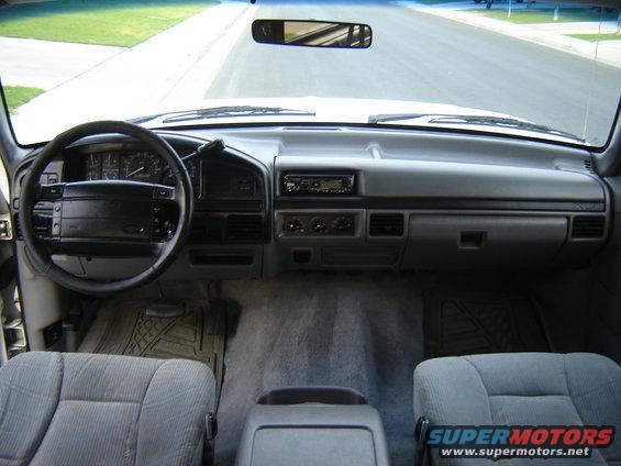 1996 Ford Bronco interior, gray seats, dashboard with radio and steering wheel