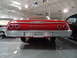 1971 Ford Ranchero - Rear view of a red 1962 Chevrolet with a Michigan license plate.