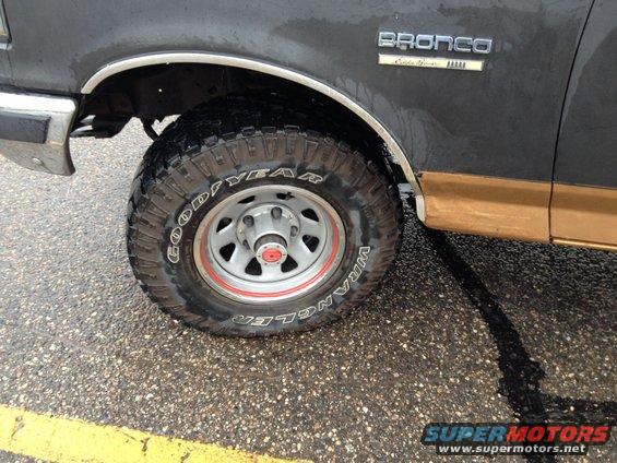 1989 Ford Bronco side view showing front wheel and fender with "Bronco" badge