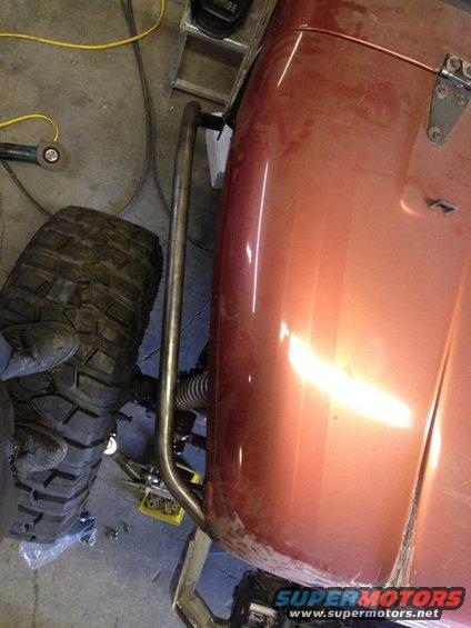 Jeep CJ-series with large off-road tire and roll cage section