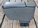 1993 Mazda MX-3 - Car armrest console with hinged lid shown from the side on a wooden background.