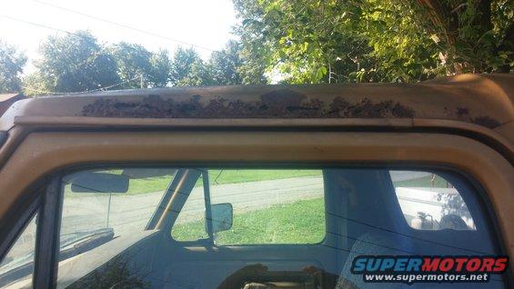 Rusted roofline on yellow 1979 Ford Bronco