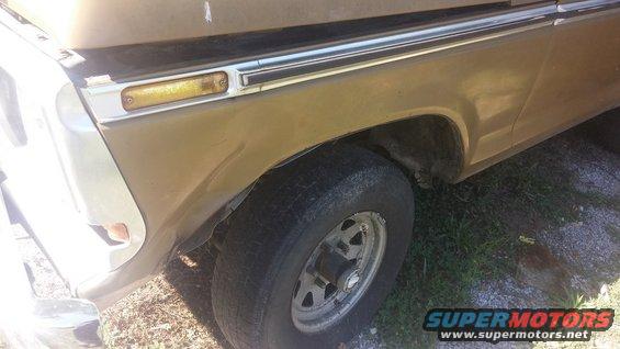 Gold 1979 Ford Bronco front fender and wheel