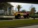 1979 Ford Bronco II - A custom monster truck painted in red and yellow Tonka colors is parked outside a restaurant.
