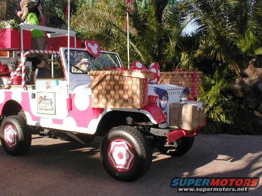 Jeep CJ-7 with pink and white polka dots, decorated with baskets and Mickey Mouse ears