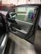 2014 Honda Accord - The interior door panel of a car is shown with the door open, revealing the car's interior and a garage setting.