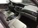 2014 Honda Accord - The interior of a car shows light gray leather seats and a modern dashboard with wood trim accents.